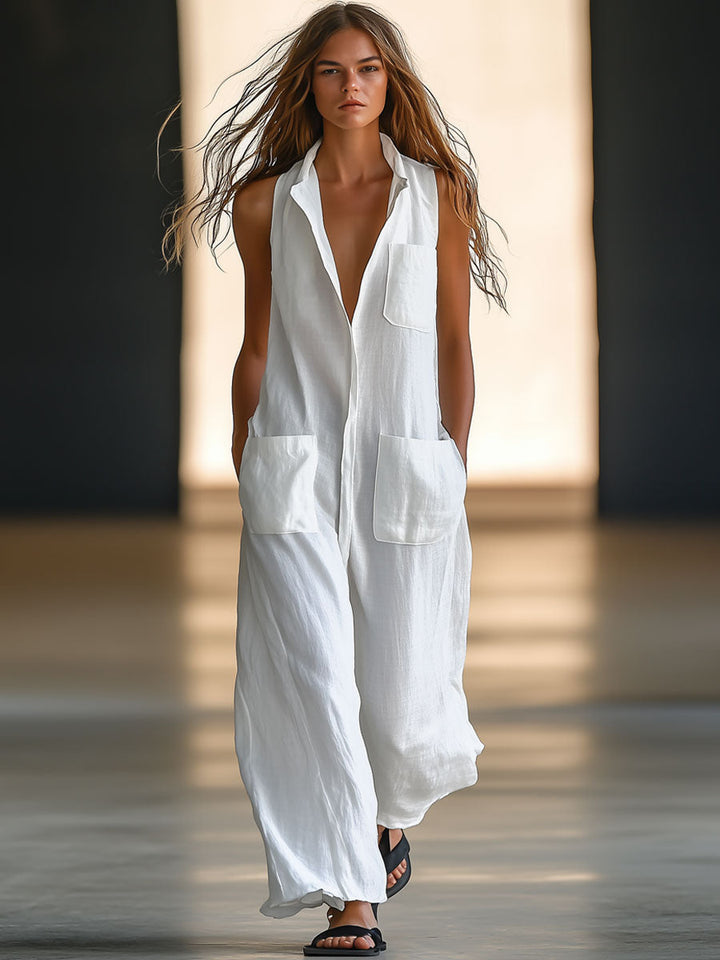 Elegant white women's deep V-neck sleeveless jumpsuit with wide leg and practical patch pockets, perfect for summer resort wear.