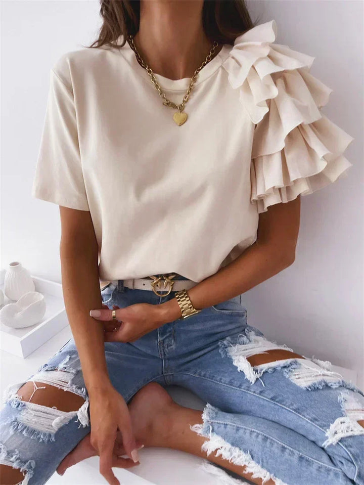 Versatile beige women's ruffle top, an elegant design offering comfortable wear for summer.