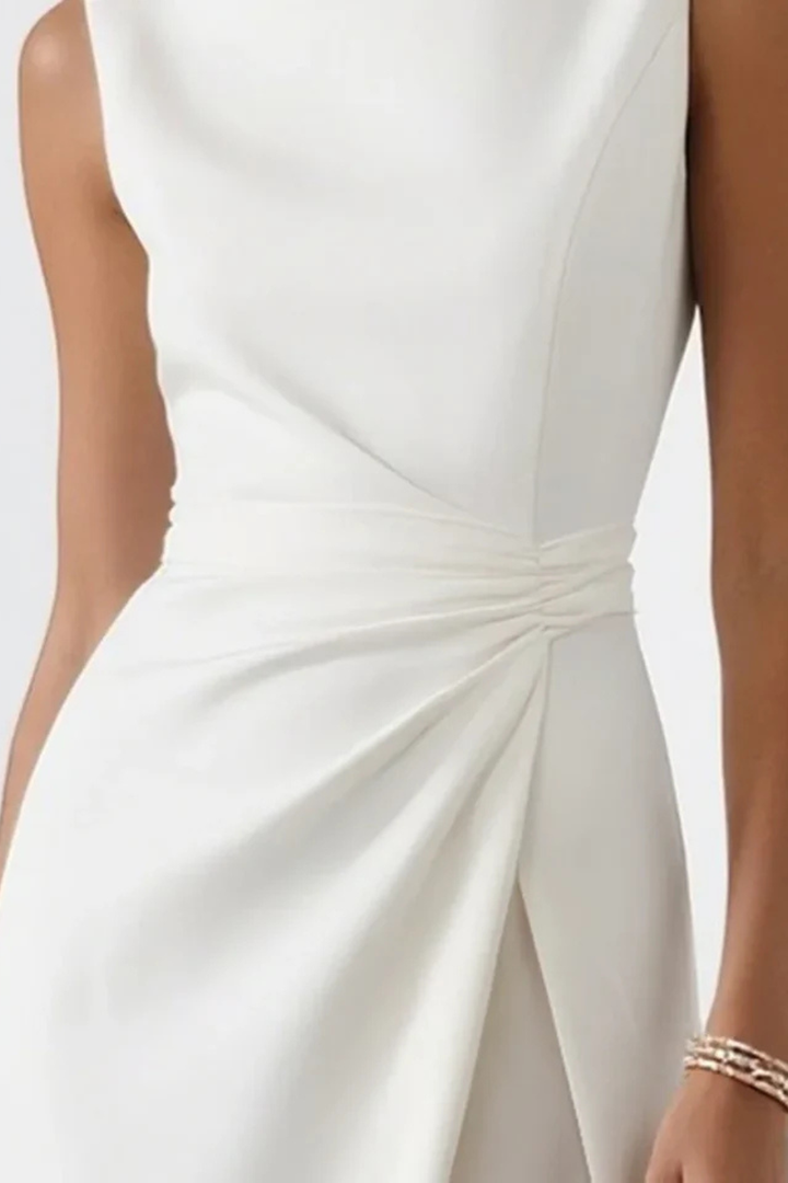 Graceful women's sleeveless white maxi dress, perfect for formal events. Features a chic side slit and elegant draped waist.