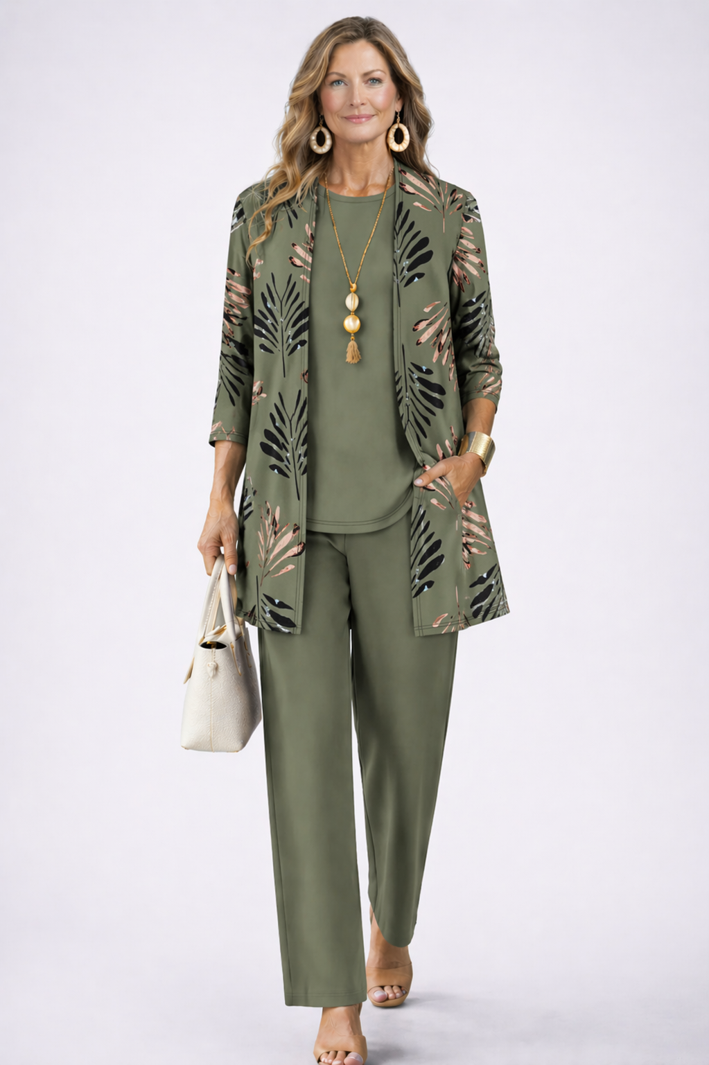 Elegant women's 3-piece blazer, top, & relaxed trousers set. Perfect for office or chic casual wear.