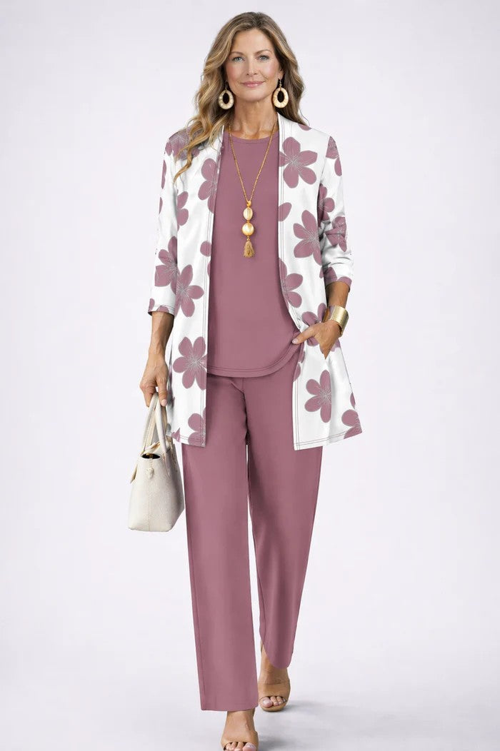 Side view of a woman in a coordinated 3-piece blazer set with relaxed trousers, showcasing flow.