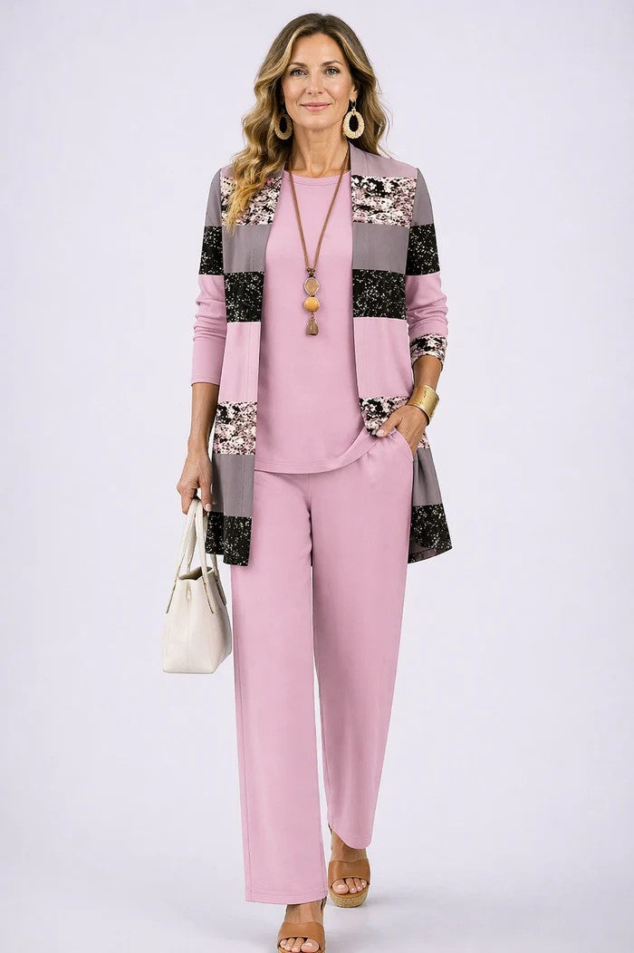 Model showcases a women's 3-piece blazer, top, & relaxed trousers set. Sophisticated office wear.