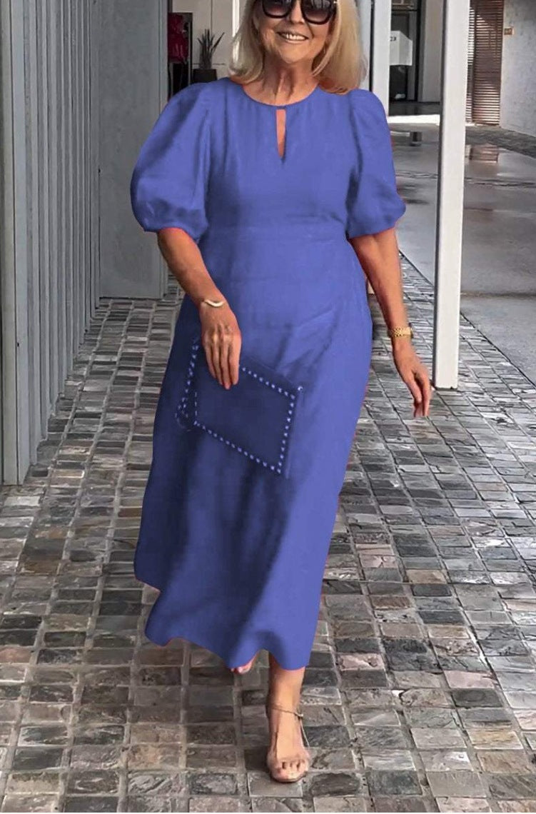 Flowing A-line midi dress for women, elegant puff sleeves & keyhole. Ideal formal summer occasion wear or wedding guest.