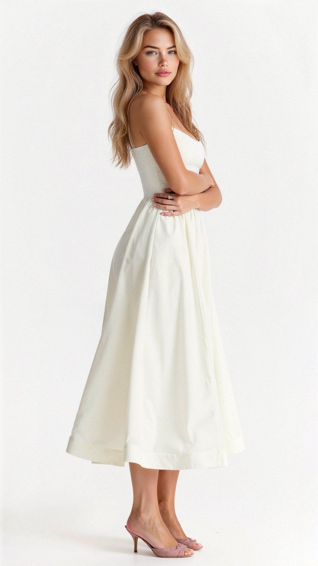Stylish women's A-line midi dress with spaghetti straps for spring/summer occasions.