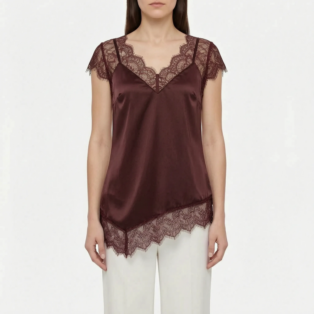 Stylish women's asymmetrical blouse with sheer details & V-neck. Elegant & modern for party or summer wear.