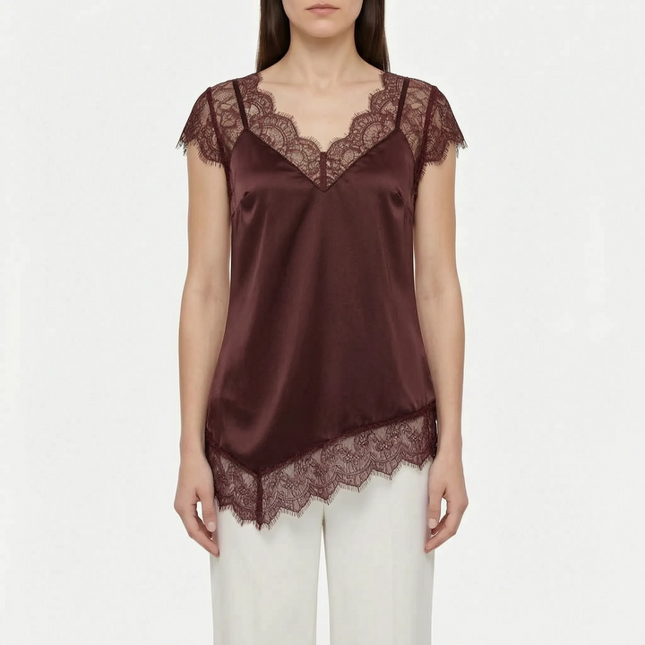 Stylish women's asymmetrical blouse with sheer details & V-neck. Elegant & modern for party or summer wear.