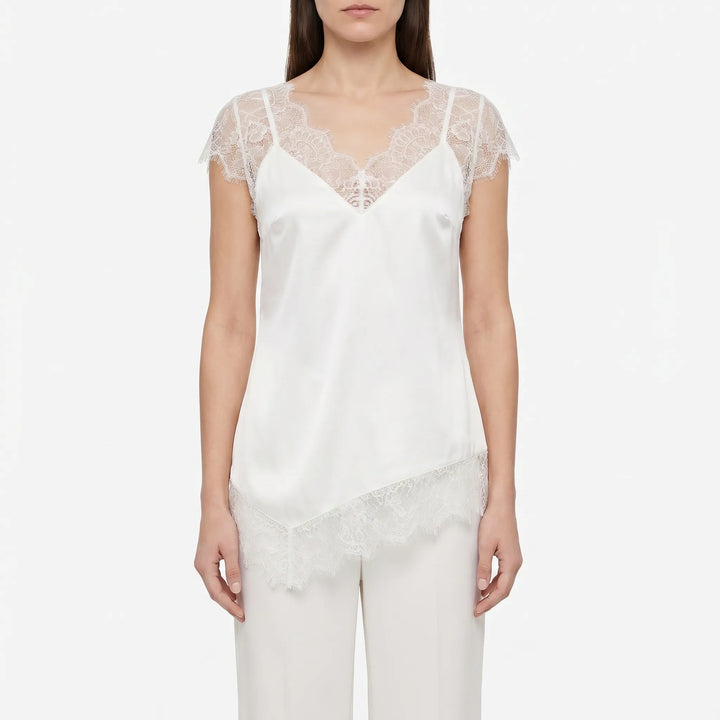 Elegant V-neck asymmetrical women's top with delicate sheer accents. Perfect fashion choice for a dressy evening out.