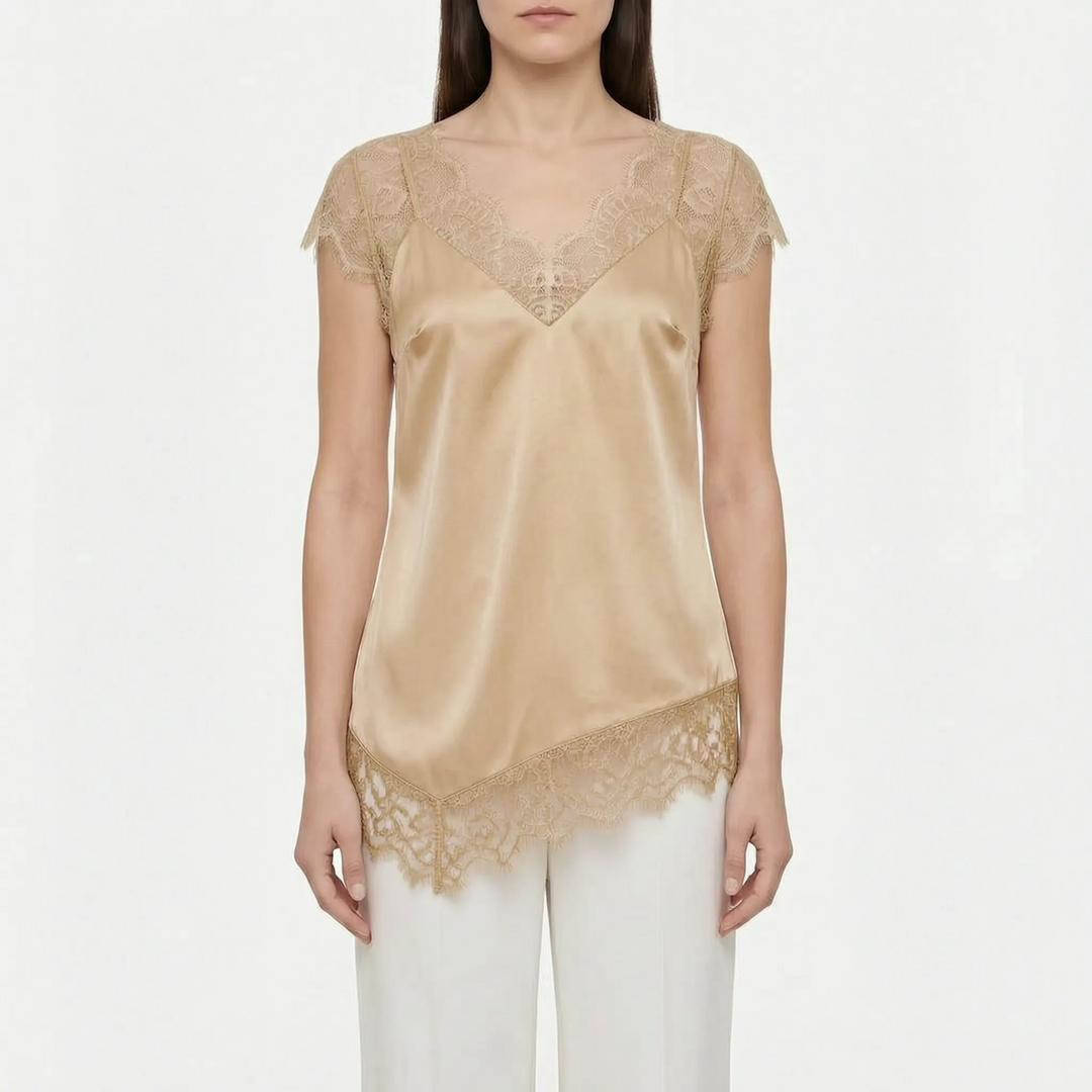 Unique asymmetrical women's top with trendy sheer paneling & V-neck. A chic choice for modern party attire.