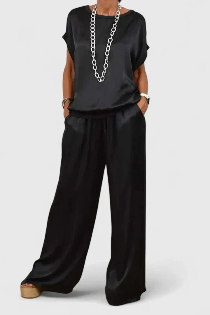 Elegant women's batwing top & wide leg trouser two-piece set. Chic, comfortable loungewear for smart casual style.