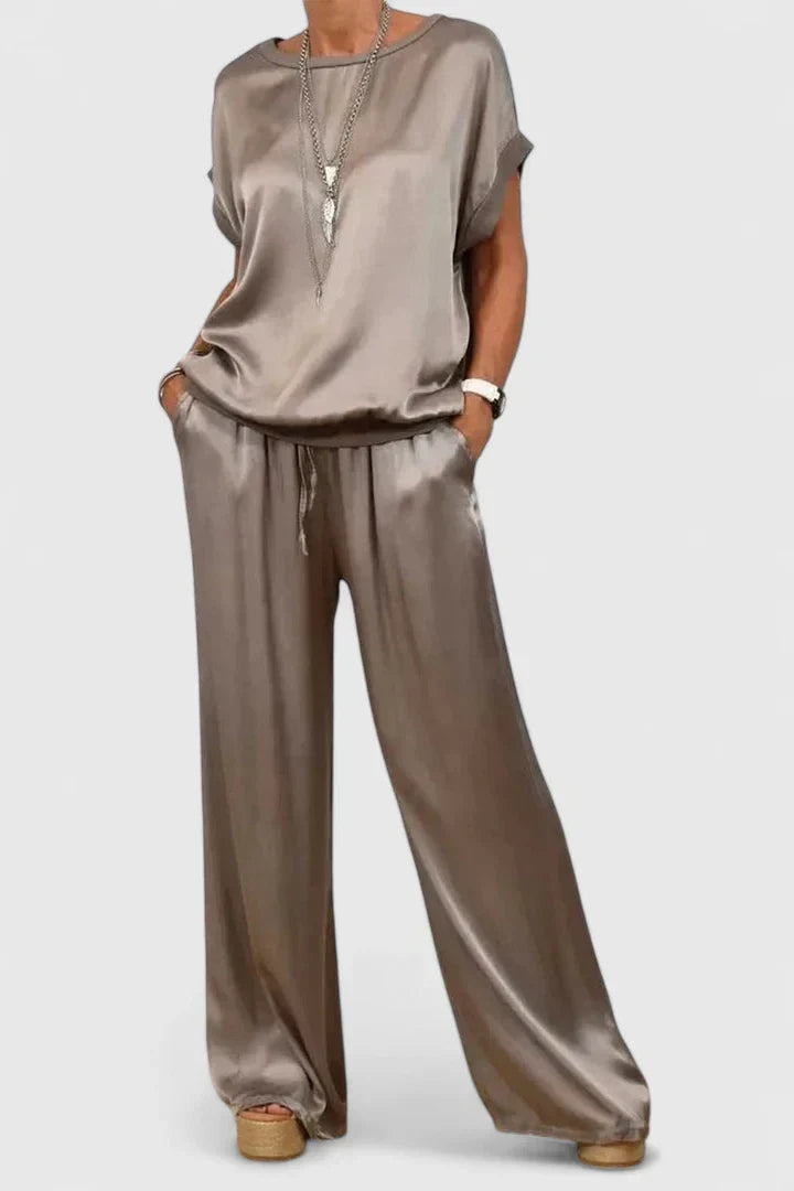 Women's comfortable matching set: chic batwing top & flowing wide-leg trousers. Perfect for elegant smart casual wear.