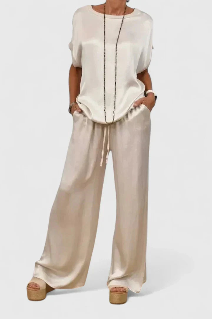Sophisticated women's batwing top and wide leg trouser set. A comfortable, elegant two-piece for versatile styling.
