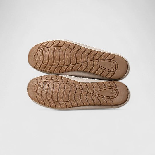 Feminine women's beige ballet flats with comfortable slip-on design, perforated floral and scalloped edge.