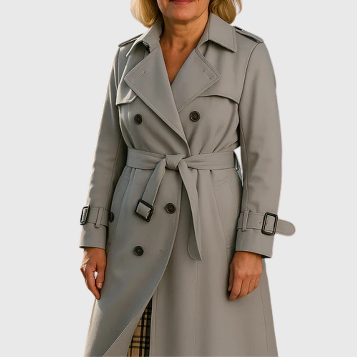 Back view of a women's water-resistant trench coat, showcasing the belted waist & classic design.
