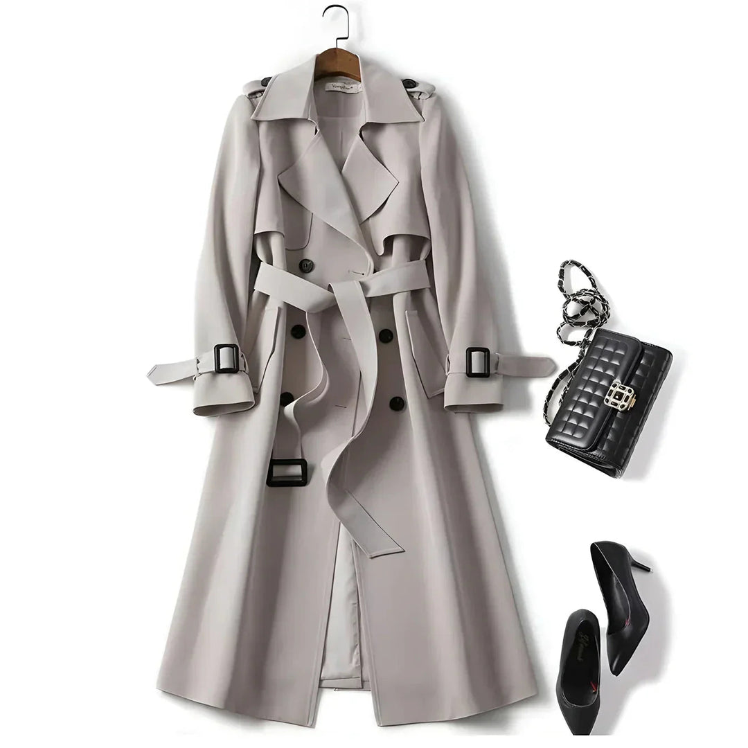 Stylish women's double-breasted trench coat, belted for a flattering silhouette. Water-resistant outerwear.