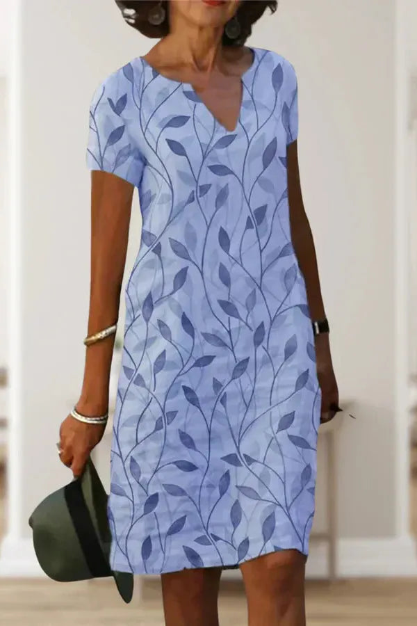 Beautiful women's elegant midi dress with a flattering belt, perfect for office or a stylish party.