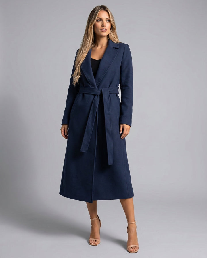Sophisticated ladies belted trench coat, structured for an elegant look. Versatile long outerwear, ideal for chic office fashion.
