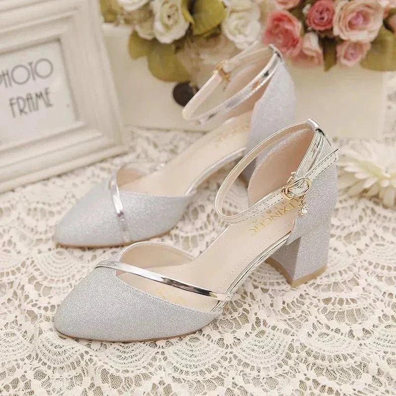 Elegant women's black ankle strap block heel pumps, perfect for formal events or versatile party wear.