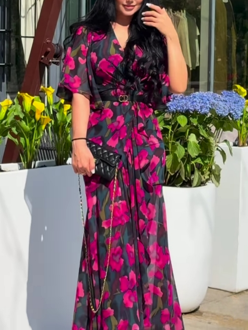 Elegant women's black floral print maxi dress with V-neck and stylish trumpet sleeves. Perfect for summer parties.
