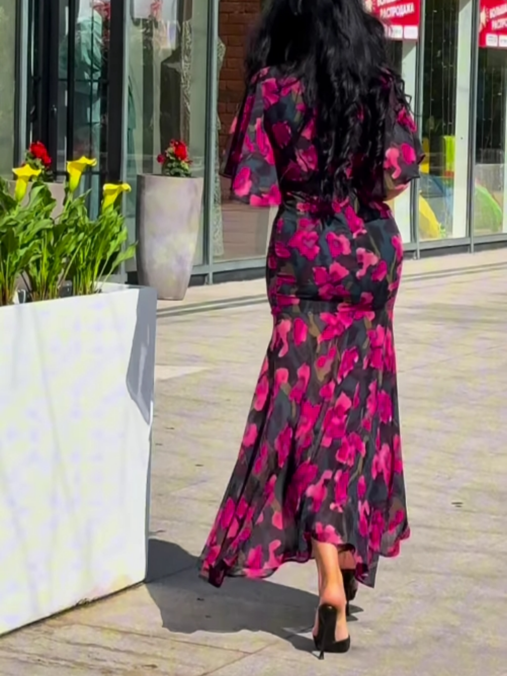 Versatile women's black floral print V-neck maxi dress with unique trumpet sleeves. A chic statement piece for any occasion.