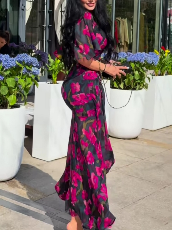 Women's black floral print maxi dress, V-neck, trumpet sleeves. Elegant summer fashion, party wear, or casual chic.