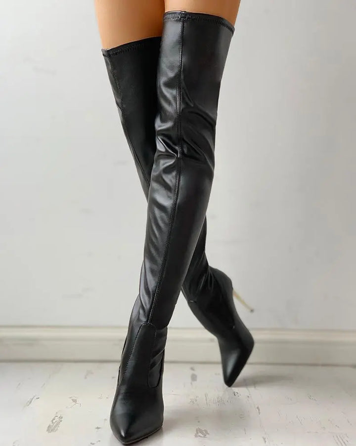 Elegant women's black knee-high zip-up boots with a comfortable low heel, perfect for versatile fashion.