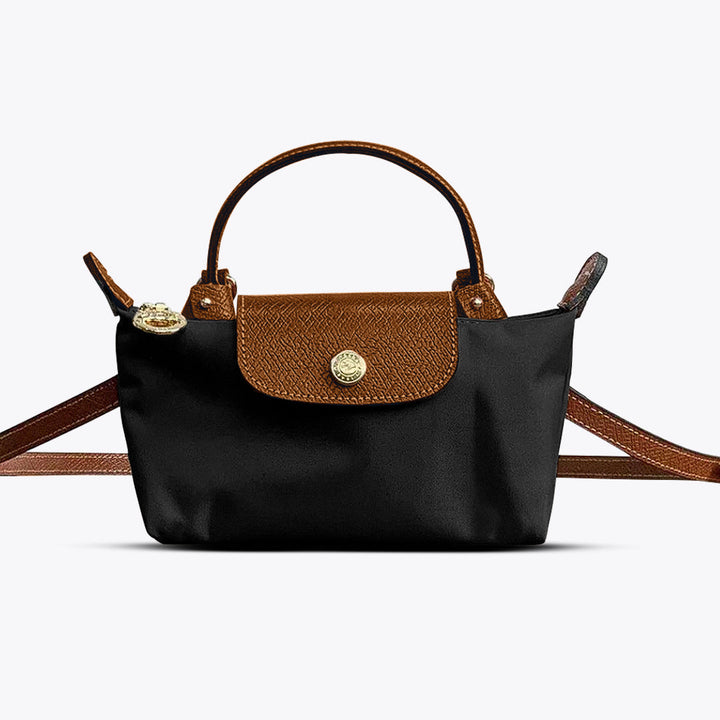 Elegant women's black leather mini crossbody bag with adjustable strap, perfect for daily fashion & essentials.
