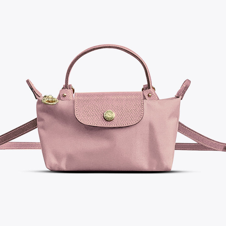 Close-up of an elegant black leather women's mini crossbody bag, highlighting its quality and adjustable shoulder strap.