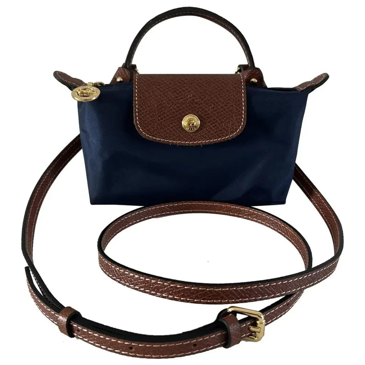 Women's versatile black leather mini crossbody bag, combining elegant design with a comfortable adjustable strap for daily wear.