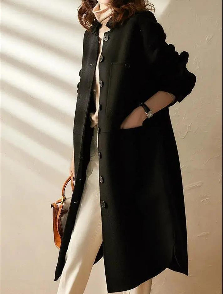 Elegant women's black long trench coat, perfect for versatile formal or casual chic outerwear fashion.