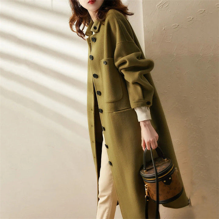 Stylish women's long green trench coat for versatile fashion; elegant outerwear for formal or casual chic.