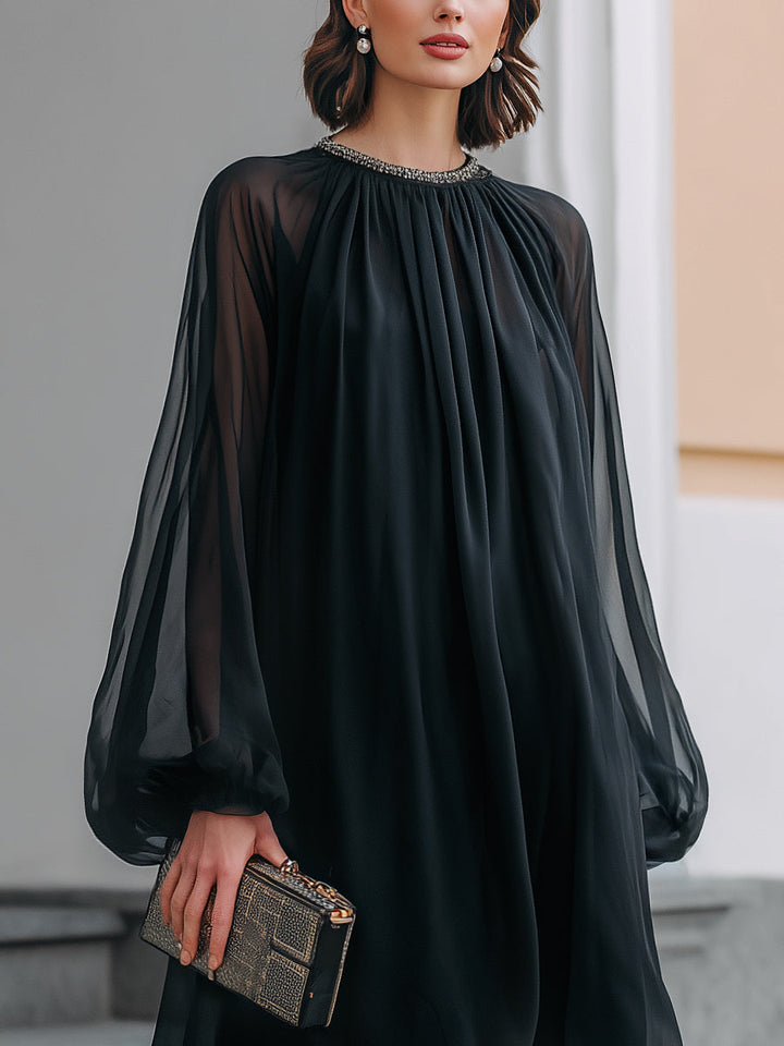 Women's elegant black mini dress featuring a detailed embellished neck & chic flowing balloon sleeves for party wear.