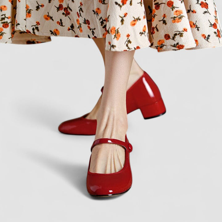 Classic women's elegant patent Mary Jane shoes, featuring a sleek finish, comfortable block heel, and round toe.