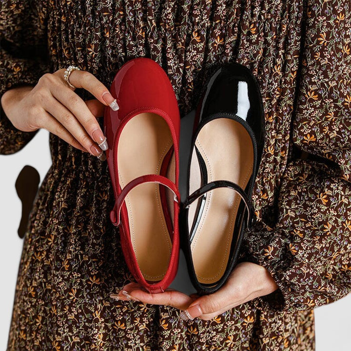 Glossy patent finish Mary Jane shoes for women, designed with a secure strap, practical block heel, and chic round toe.