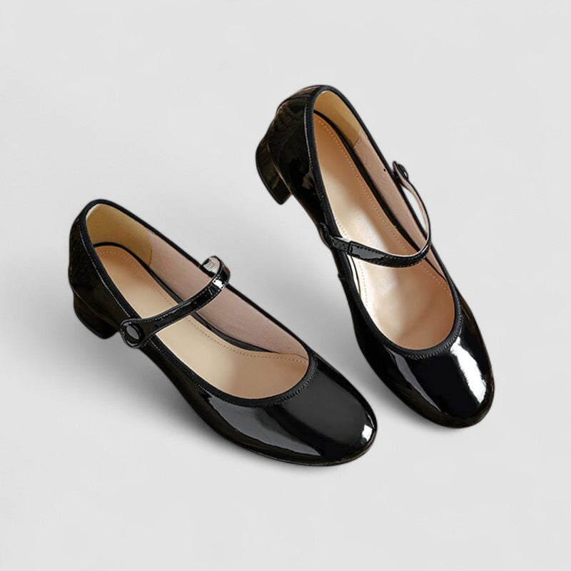 Stylish women's patent Mary Jane heels, featuring an elegant strap, stable block heel, and comfortable round toe.