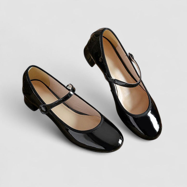 Stylish women's patent Mary Jane heels, featuring an elegant strap, stable block heel, and comfortable round toe.