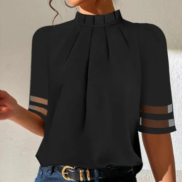 Casual & elegant women's black pleated top, perfect for effortless style. Versatile design suits any occasion.