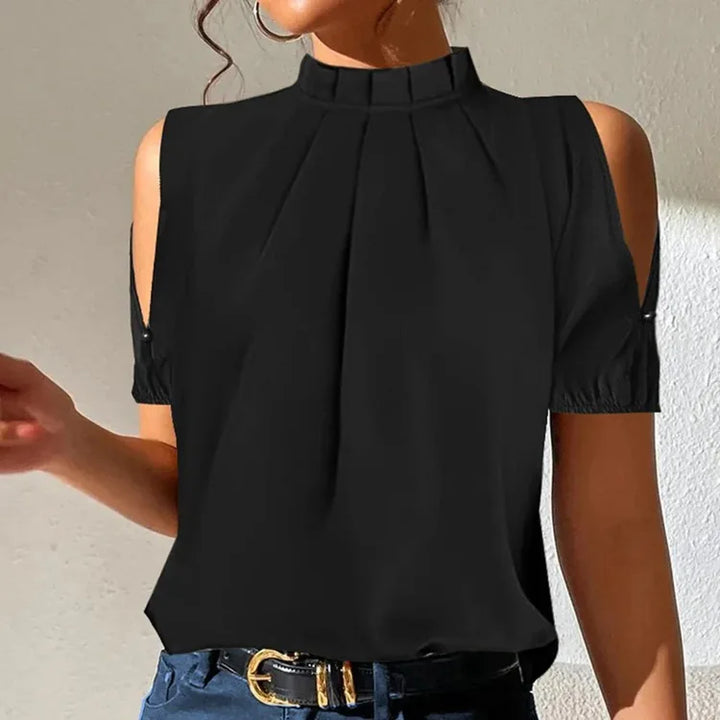 Sleek women's black pleated sleeveless top, offering a chic and versatile look for office or casual wear.