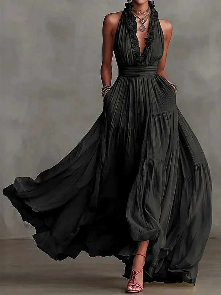 Stunning backless women's maxi dress with delicate ruffle trim, ideal for an elegant evening party or special occasion.