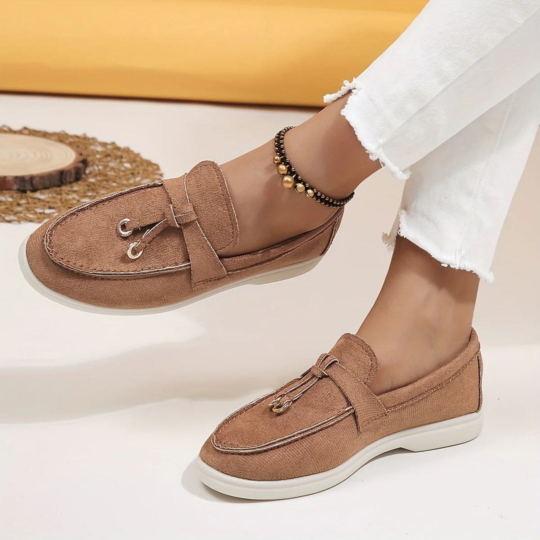 Elegant women's black tassel loafers, perfect for sophisticated style & comfortable all-day wear.