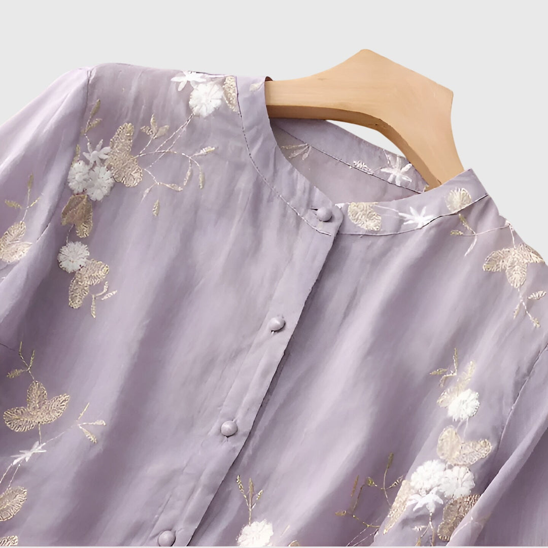 Chic women's blouse with detailed floral embroidery, an elegant top perfect for special occasions or daily wear.