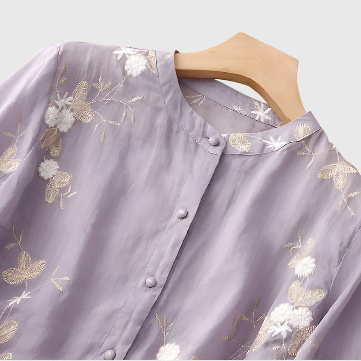 Chic women's blouse with detailed floral embroidery, an elegant top perfect for special occasions or daily wear.