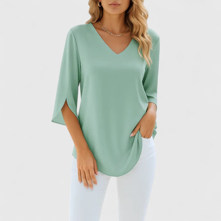 Stylish women's elegant blouse featuring a unique split sleeve design, perfect for modern fashion.