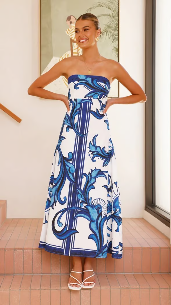 Elegant women's blue printed flowy dress with short sleeves, perfect for summer casual chic.