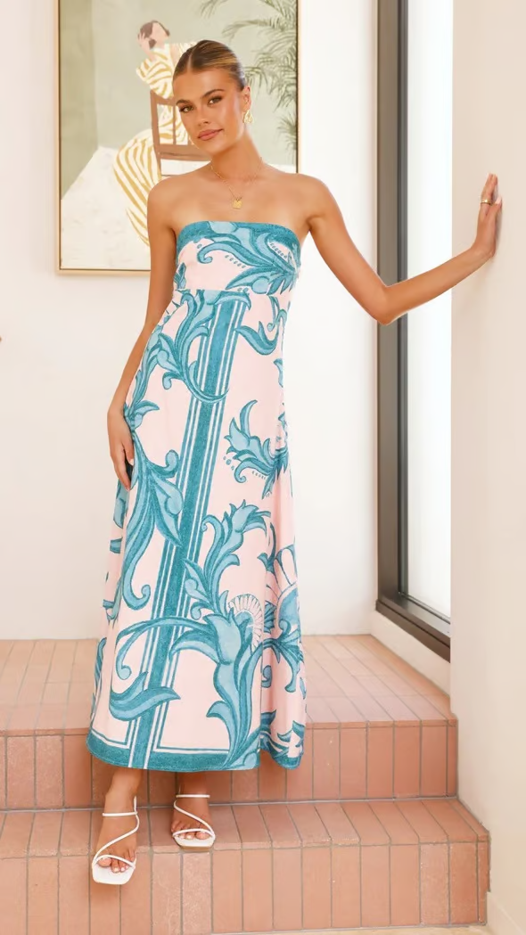 Comfortable & elegant women's short sleeve flowy dress in a light blue print, perfect for summer.