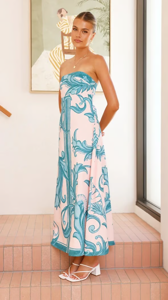 Stunning light blue printed flowy dress for women with short sleeves, elegant & summer-ready style.