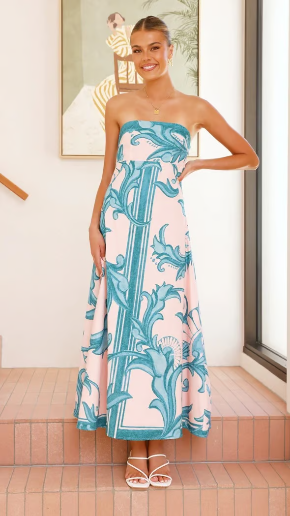 Elegant women's blue printed flowy dress, short sleeves, comfortable & stylish for casual or formal summer wear.