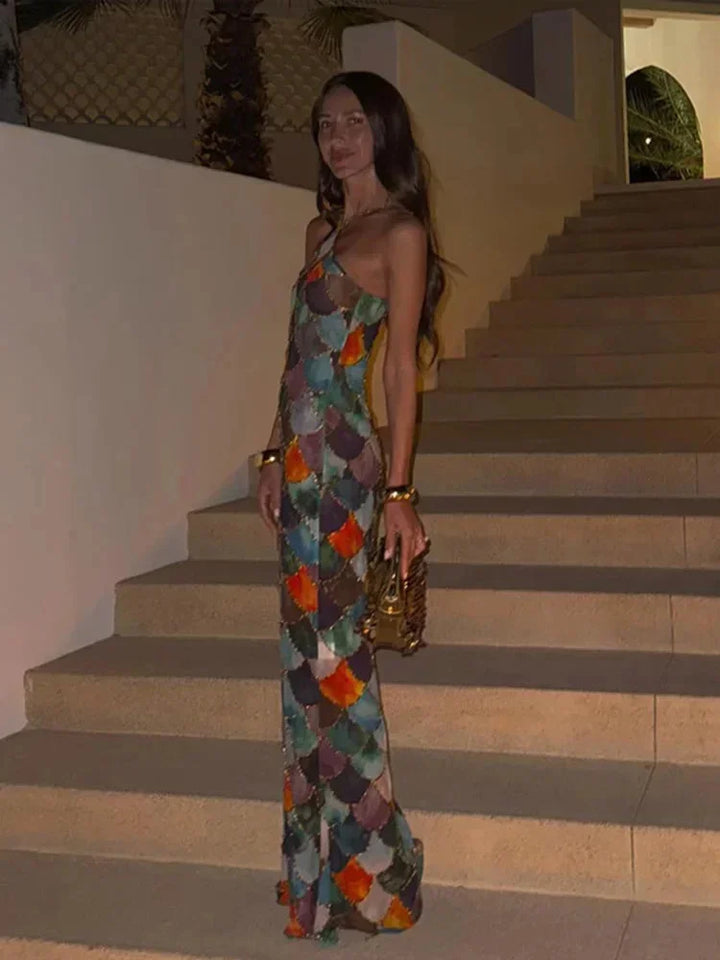 Stylish women's halter neck backless bodycon maxi dress featuring a unique abstract scale print. Great for wedding guests.