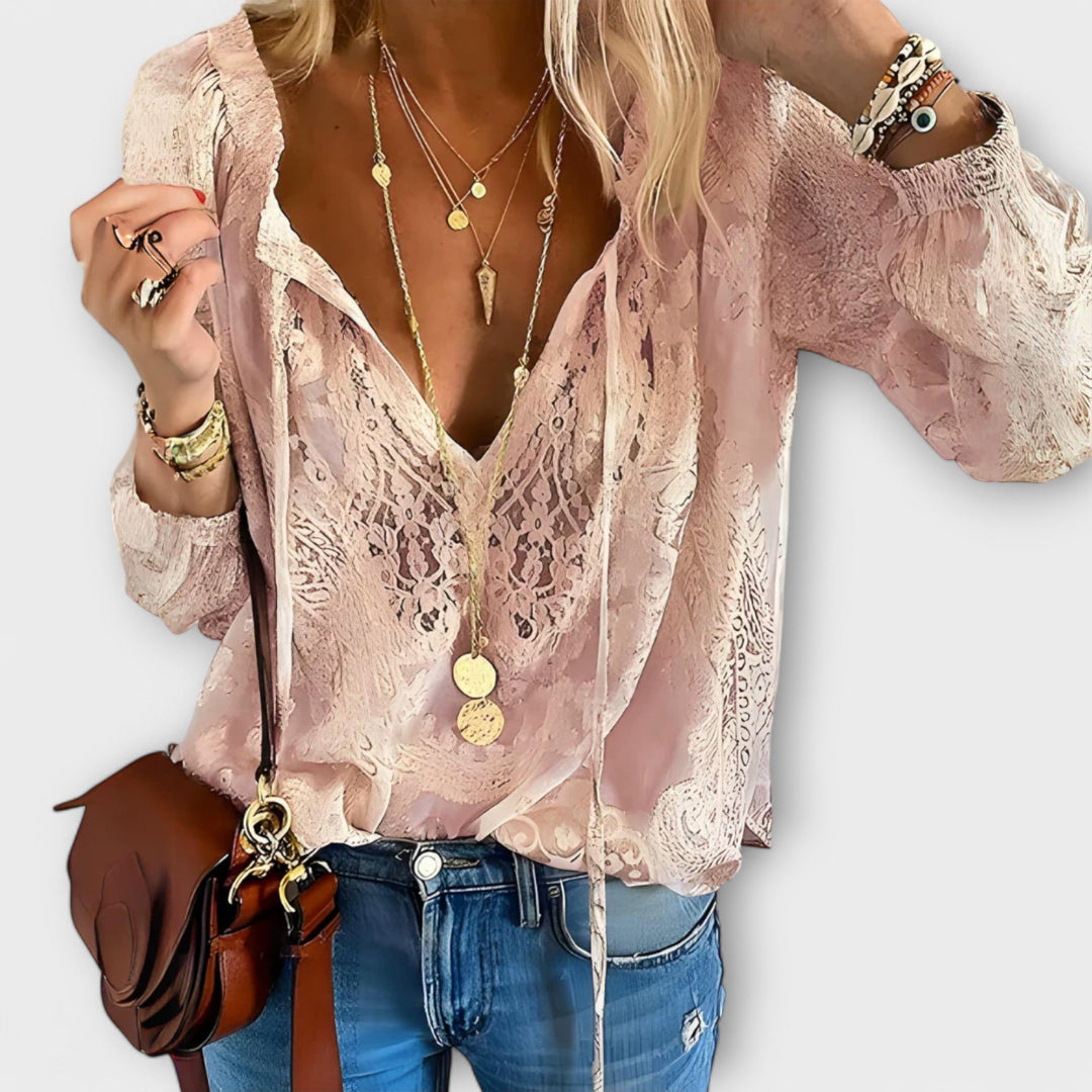 Women's elegant bohemian blouse with tie neck, a versatile long-sleeve top ideal for casual chic spring looks.