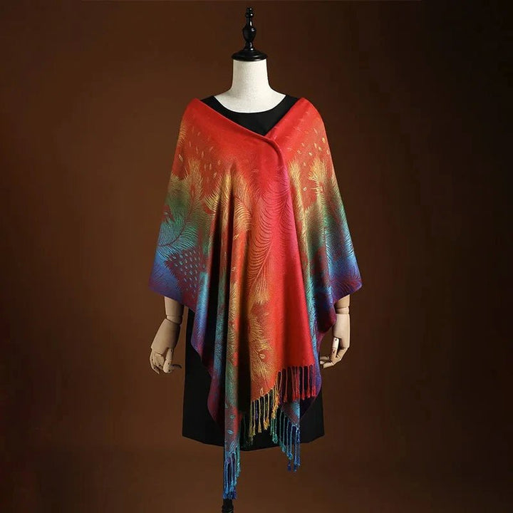 Vibrant women's shawl featuring an intricate peacock pattern and flowy bohemian fringe. Fashionable one-size wrap.