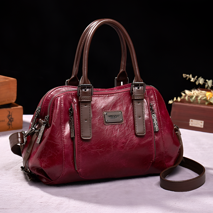 Chic croc-embossed leather Boston handbag for women, a sophisticated accessory with a structured design.